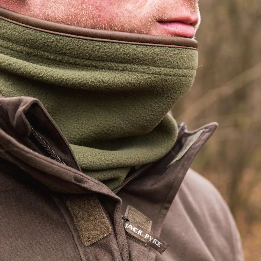 Olive green Jack Pyke Countryman neck gaitor covering the lower face for warmth