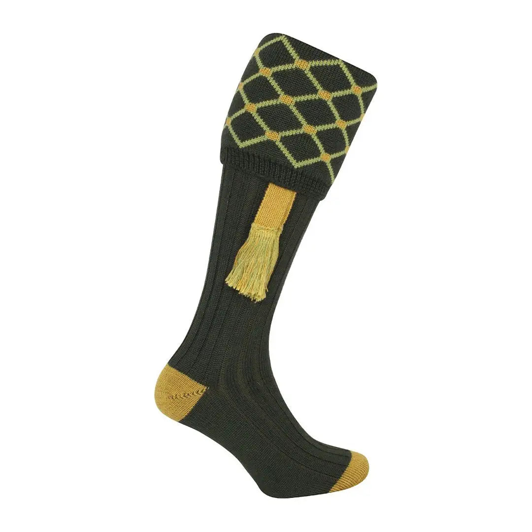 Dark green Jack Pyke Diamond Shooting Socks with yellow diamonds and tassel design