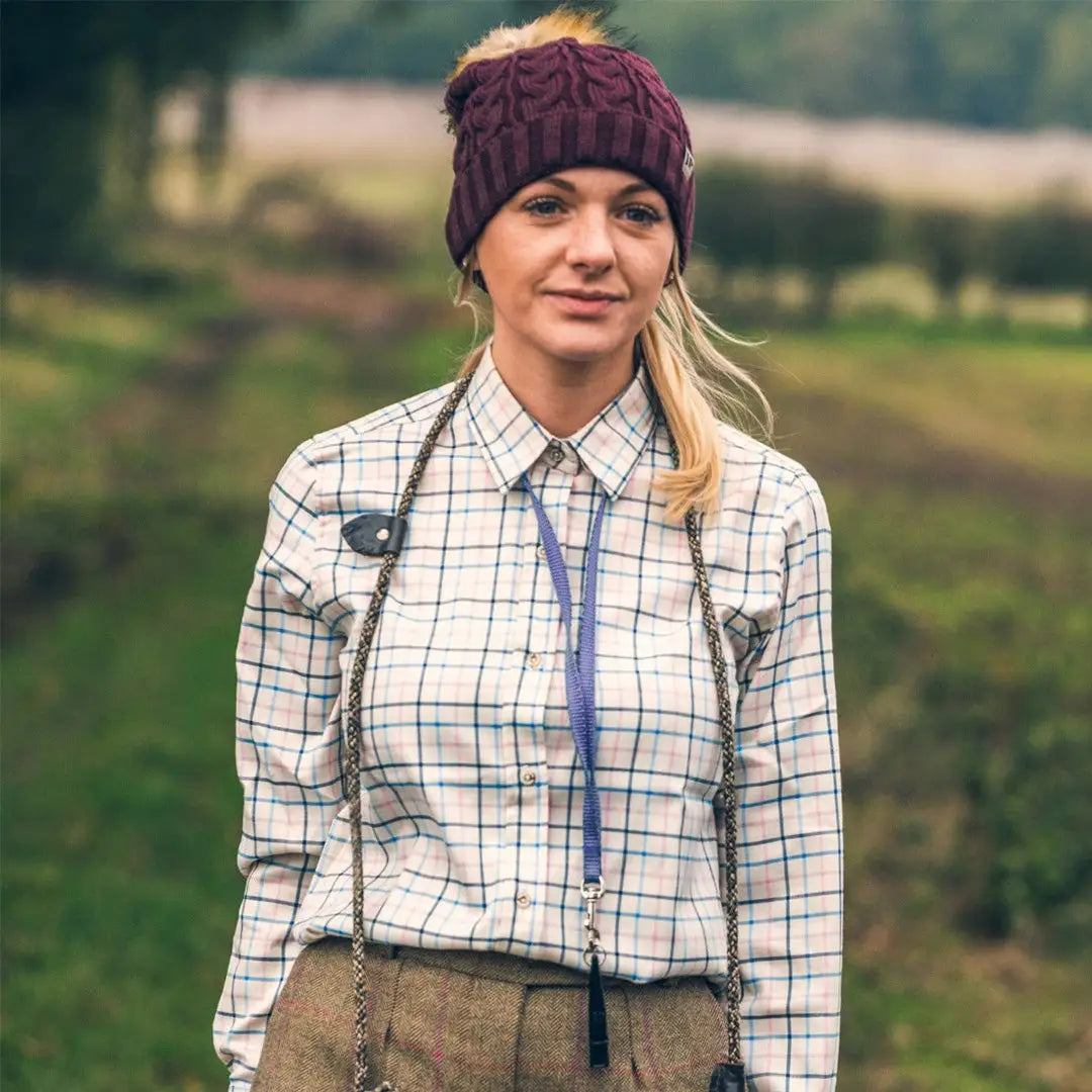 Woman in a plaid shirt and burgundy knit hat wearing Jack Pyke Ladies Countryman Shirt