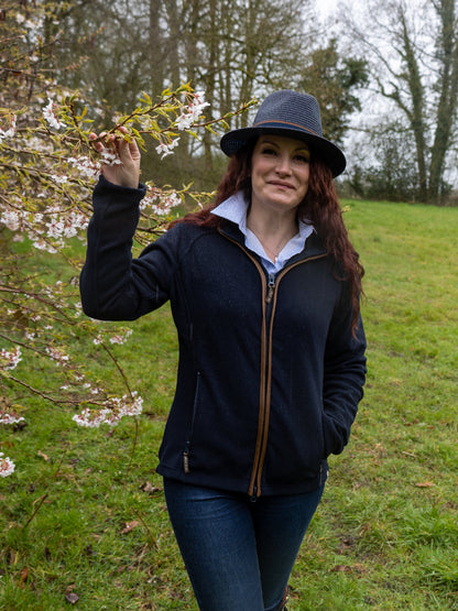 Woman wearing a Jack Pyke Ladies Fleece Jacket and hat, stylish and cozy