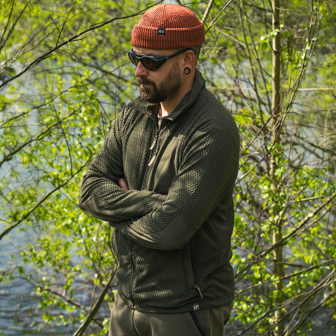 Man in olive green Jack Pyke Lightweight Z Fleece Jacket and orange beanie