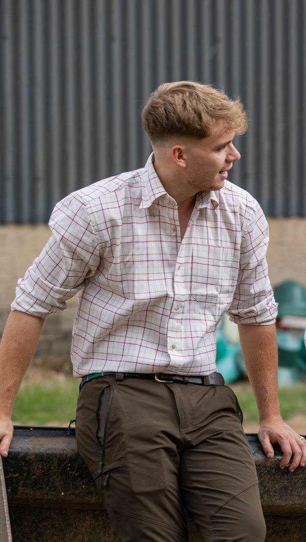 Man in plaid shirt and olive pants wearing Jack Pyke Countryman Long Sleeved Shirt