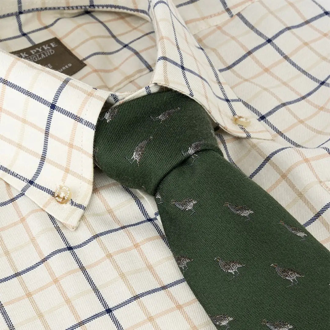 Green necktie with flying birds pattern, perfect for a Jack Pyke Partridge Silk Tie