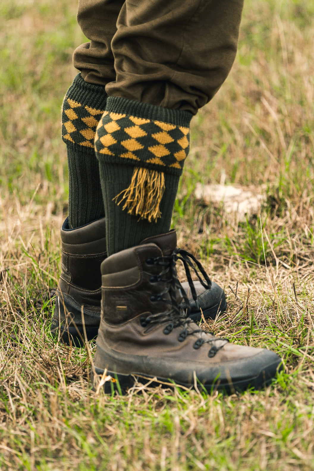 Brown leather hiking boots paired with Jack Pyke Shooting Socks for classic outdoor pursuits