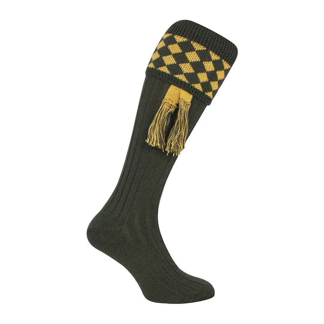 Dark green Jack Pyke shooting socks with yellow diamonds and tassels at the top