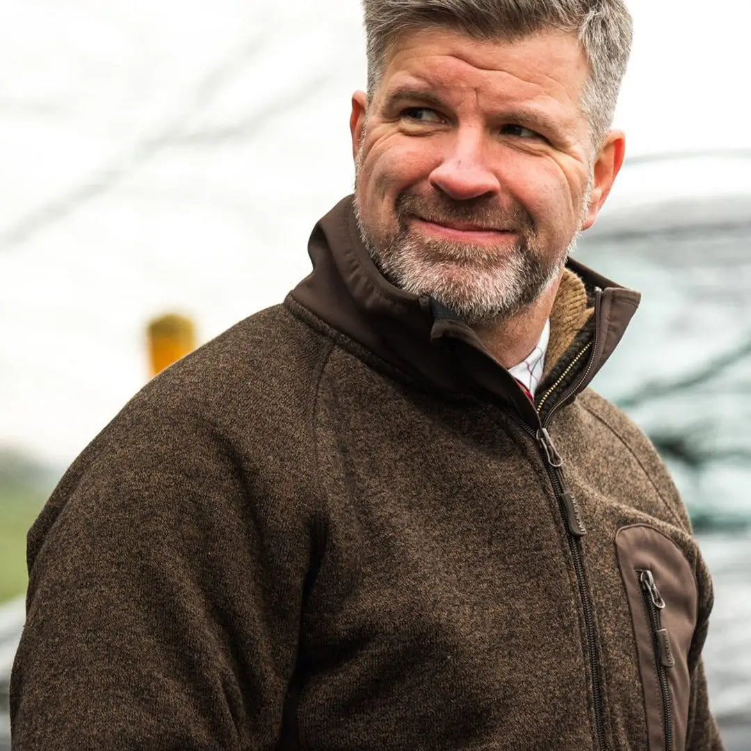 Middle-aged man in gray beard wears Jack Pyke Weardale Knitted Jacket, ready for adventure