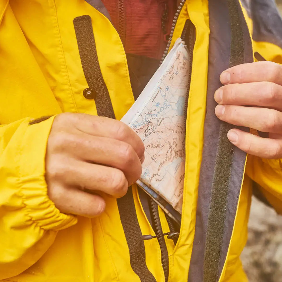 Megalodon shark tooth held in a vibrant Keela Munro Jacket for a bold look