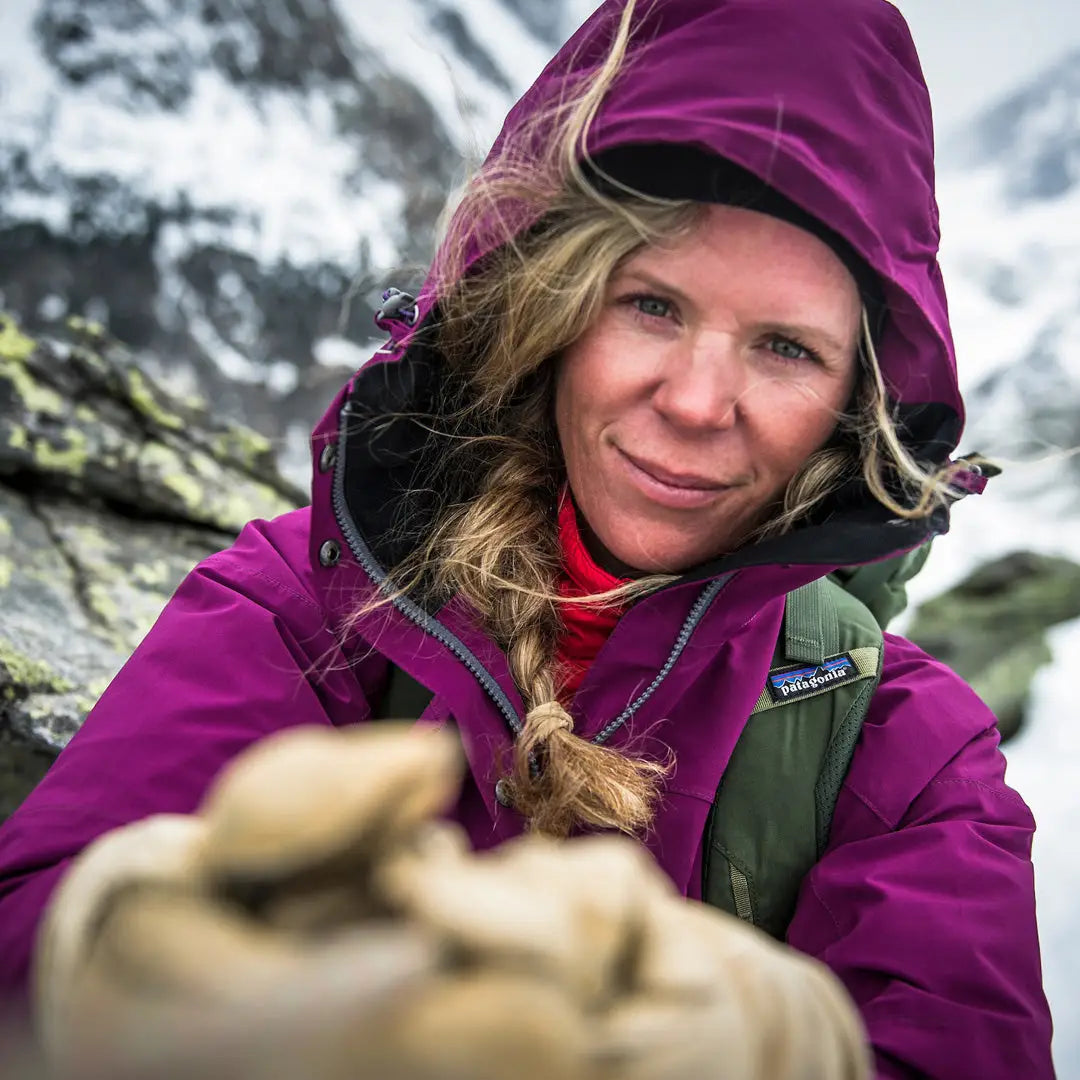 Woman in a purple Keela Womens Prosport Jacket enjoying a beautiful mountain view