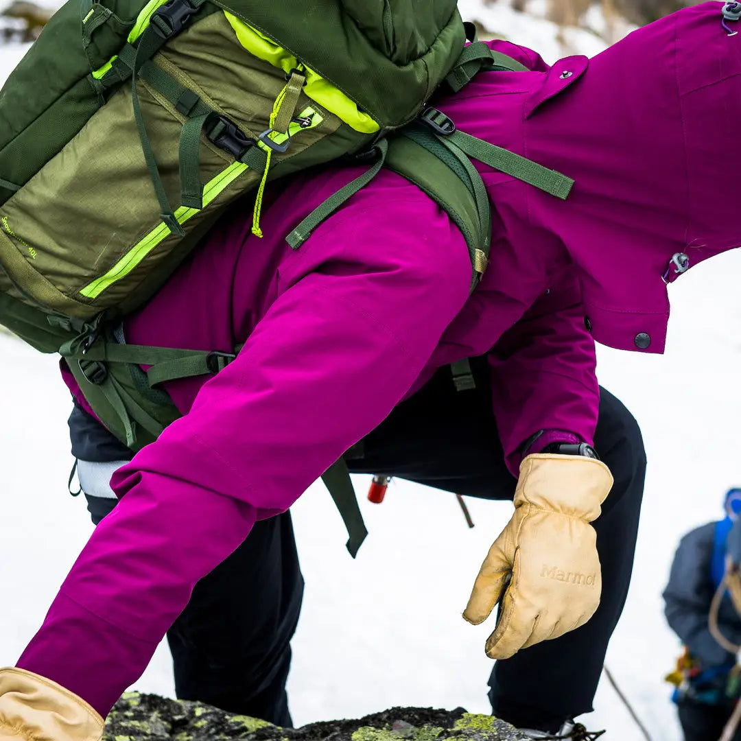 Hiking with a green backpack and Keela Womens Prosport Jacket in bright magenta