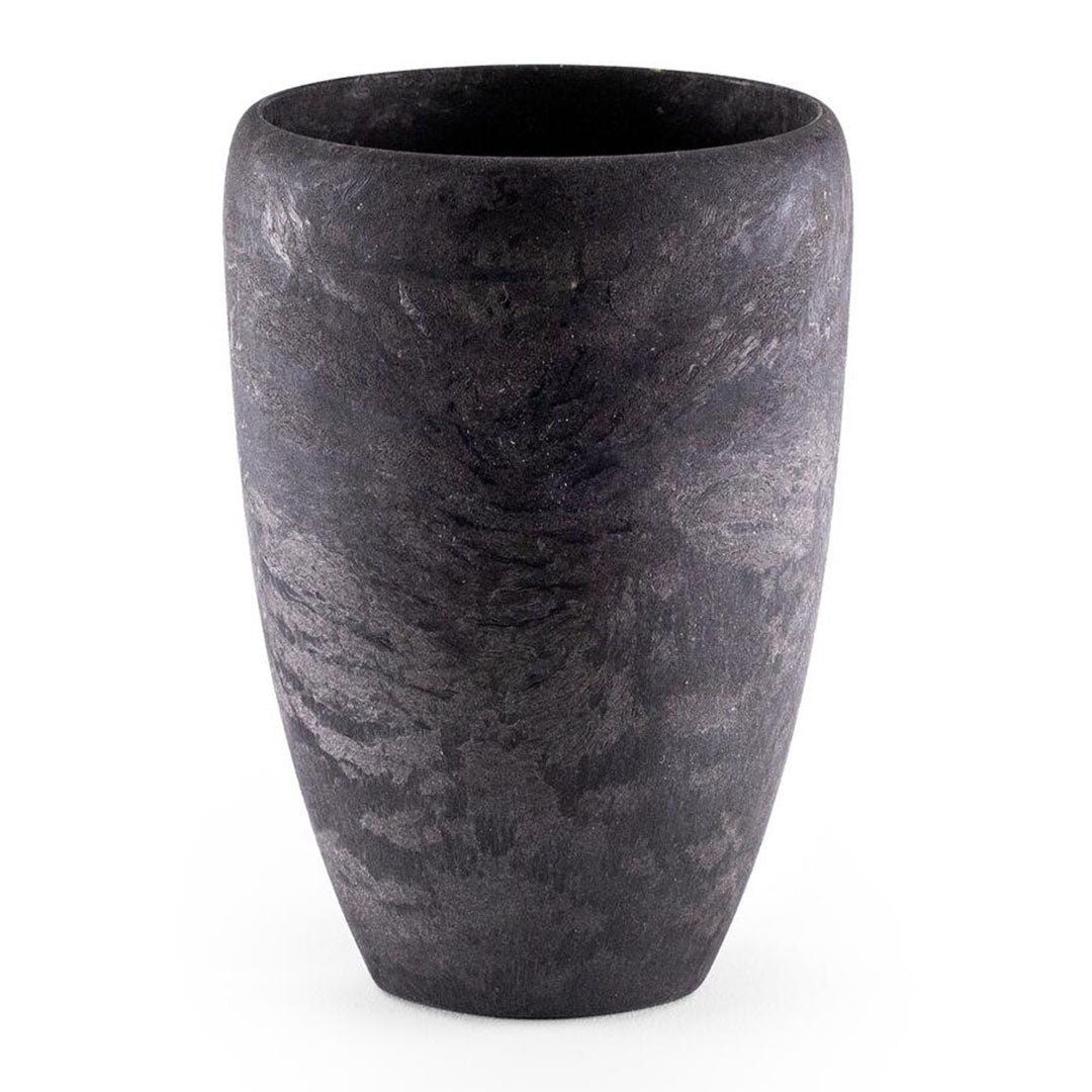 Textured dark vase complementing a Kupilka Cup for stylish country clothing decor