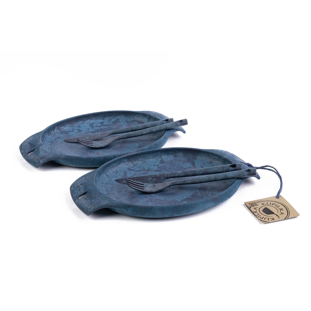 Two blue serving dishes with utensils from the Kupilka Fill That Belly Gift Set