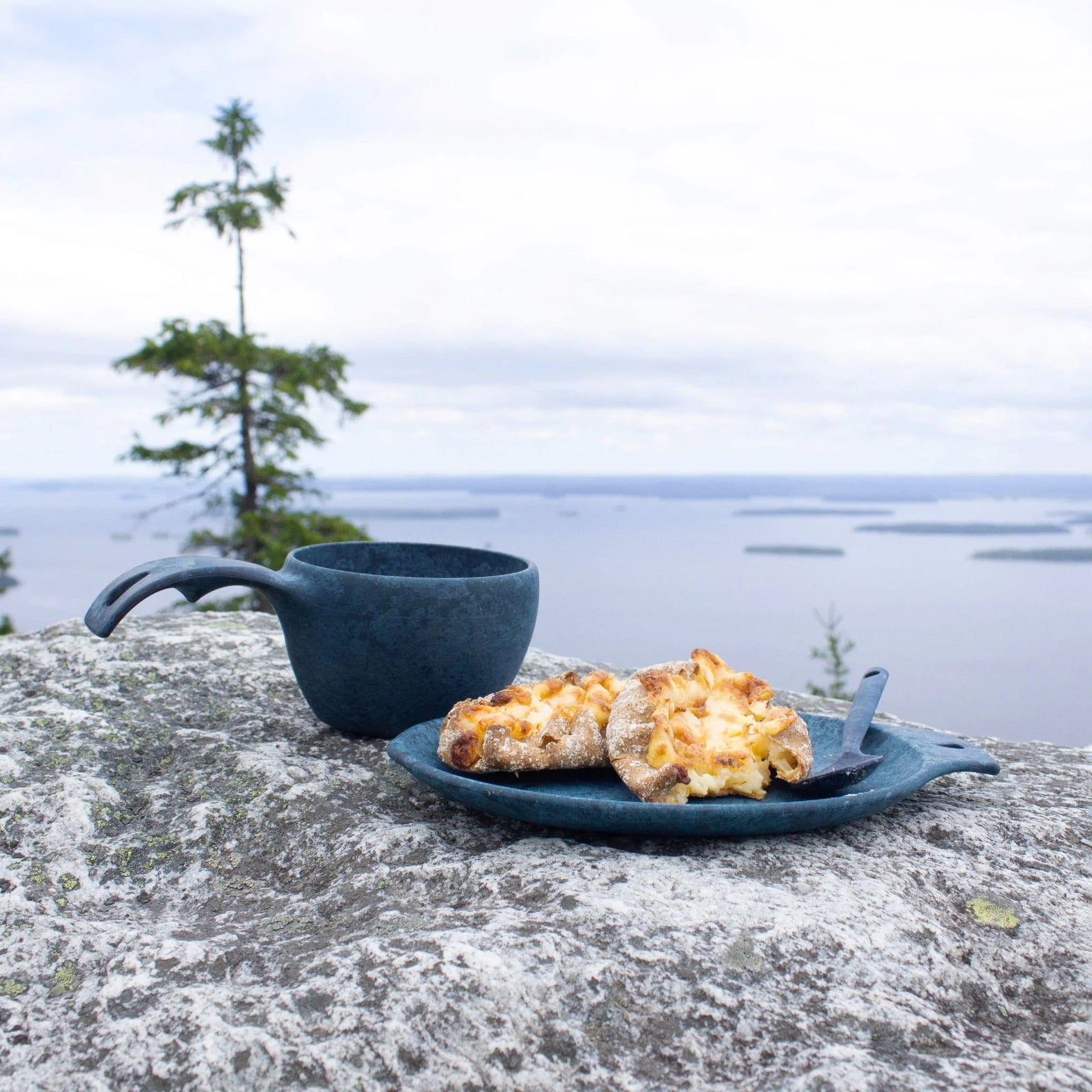 Blue cup and plate with pastries in Kupilka Gift Box, perfect for country clothing lovers