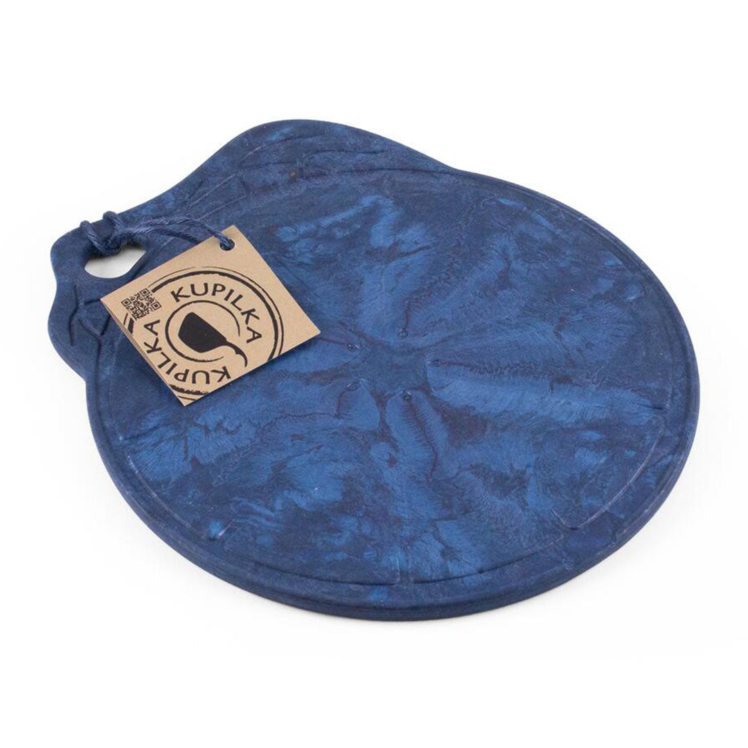 Textured blue Kupilka coaster with tag next to the Kupilka Kaarna Medium Service Tray