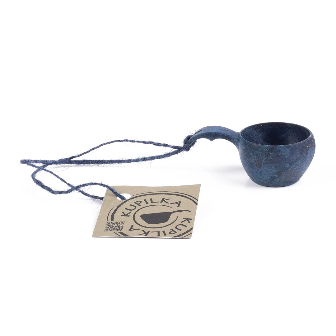 Blue wooden Kupilka Mini Cup with handle and tag, perfect for all your drinks