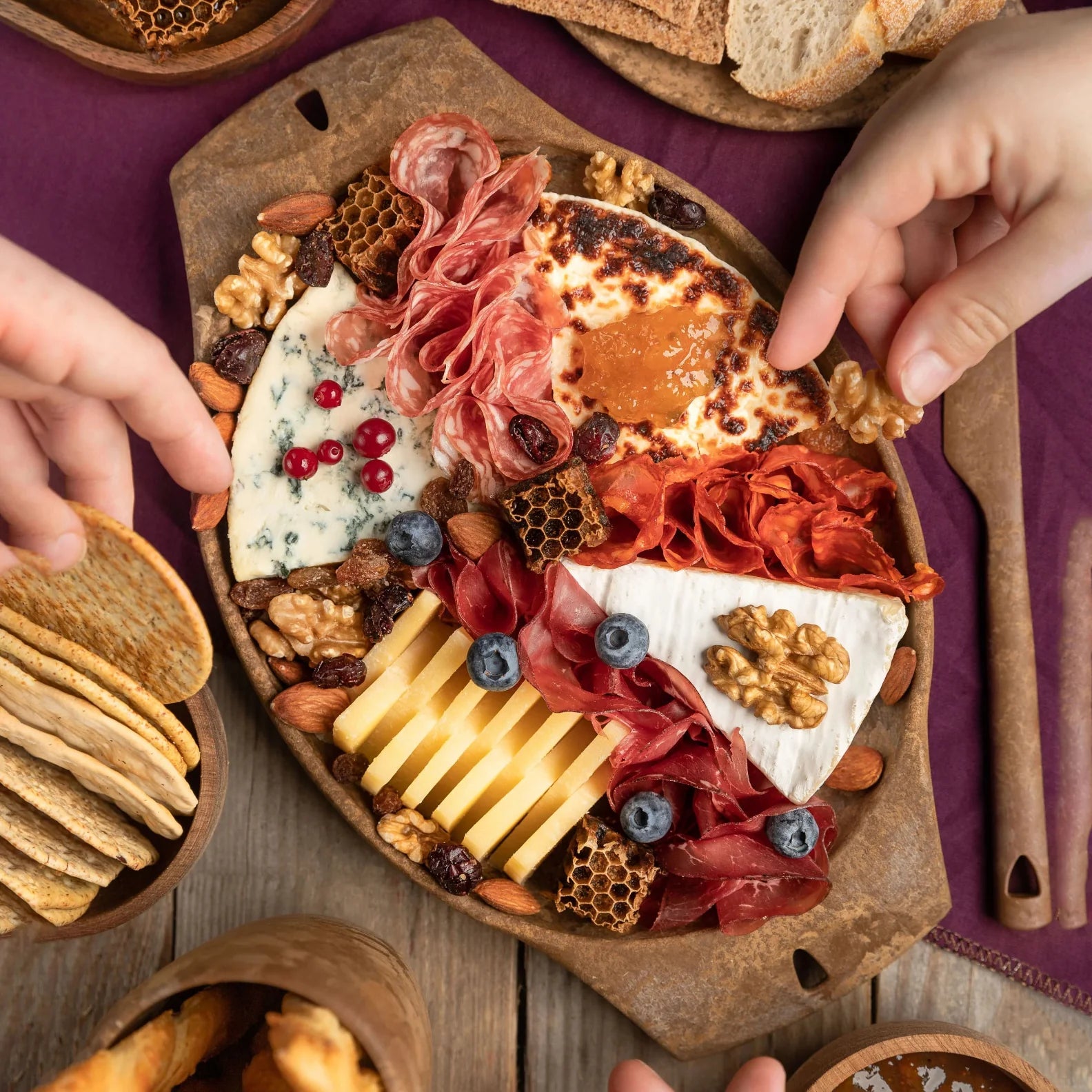 Elaborate charcuterie board on a Kupilka Plate, perfect for country clothing and hunting