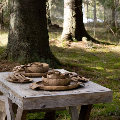 Rustic wooden tableware in the Kupilka Premium Gift Set for a cozy dining experience