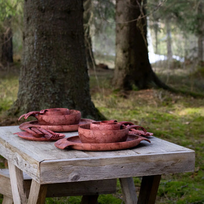 Rustic red clay dinnerware from the Kupilka Premium Gift Set for stylish dining