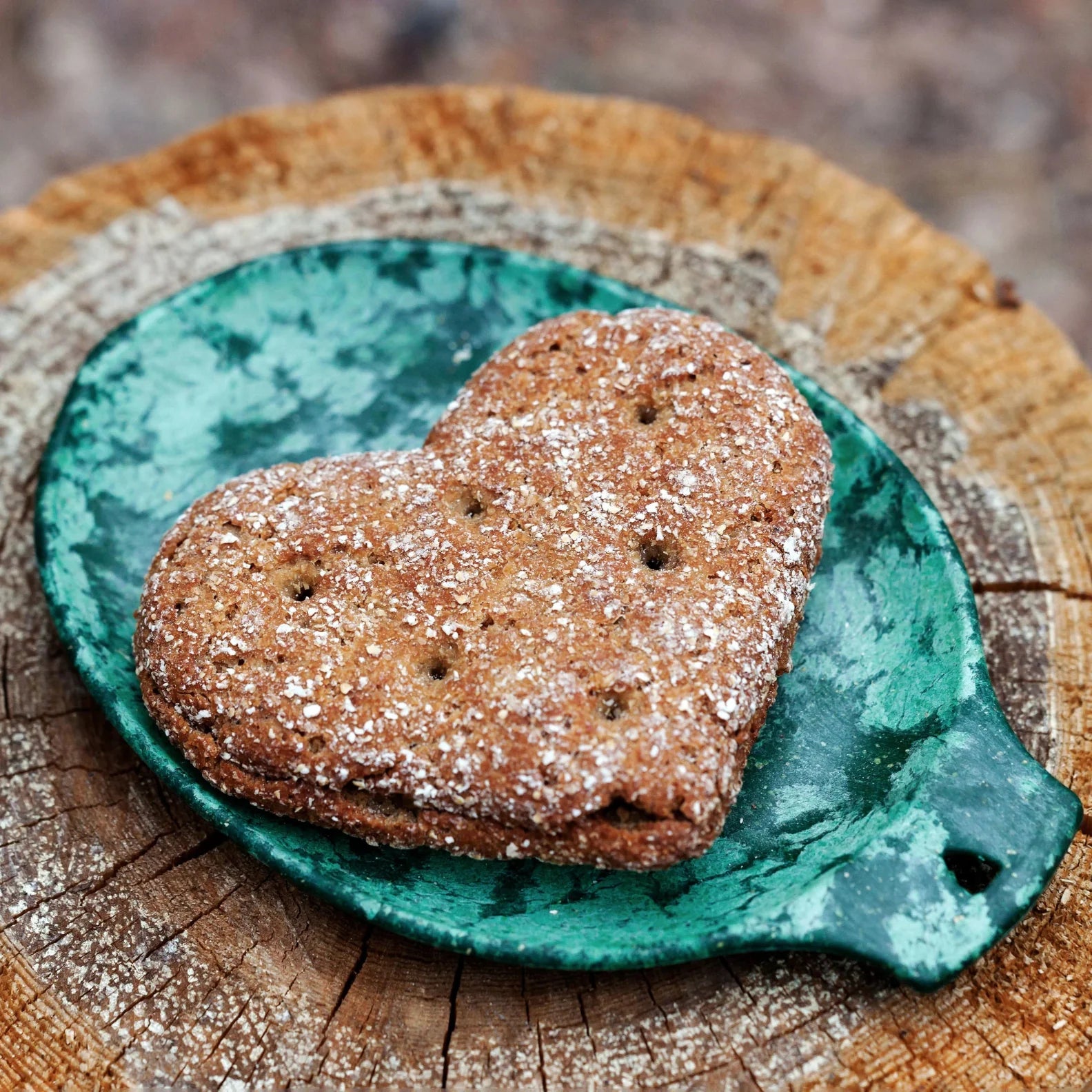 Heart-shaped whole wheat cookie on Kupilka Small Plate, perfect for country clothing lovers