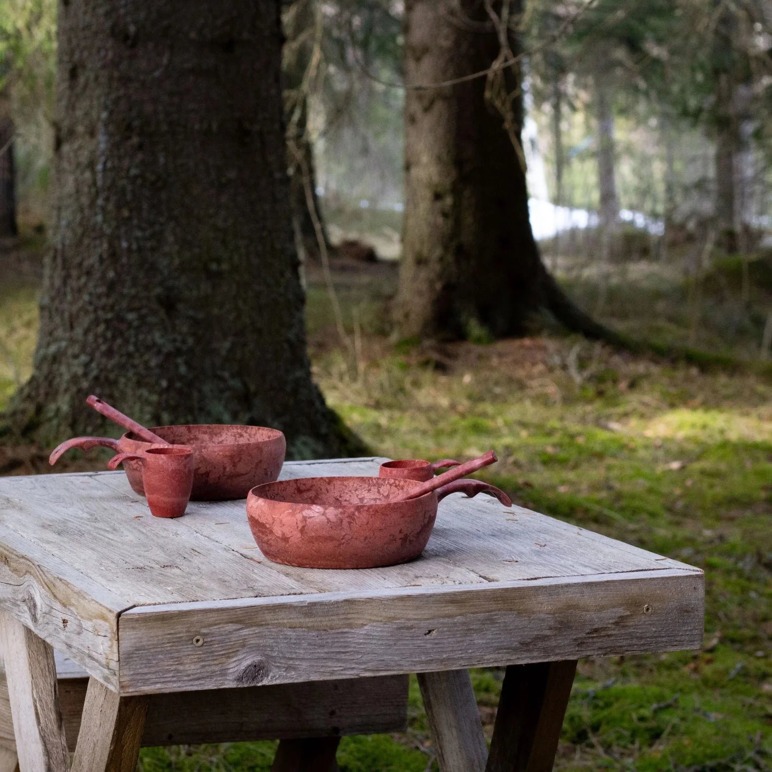 Rustic red cookware set from Kupilka Start, perfect for cozy country clothing vibes