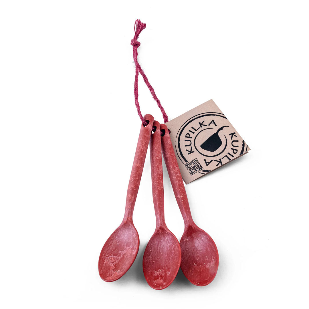 Three red spoons tied with a tag from the Kupilka Teaspoon Set display