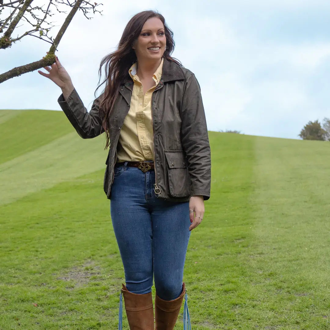 Woman in casual country style wearing an Antique Wax Jacket outdoors