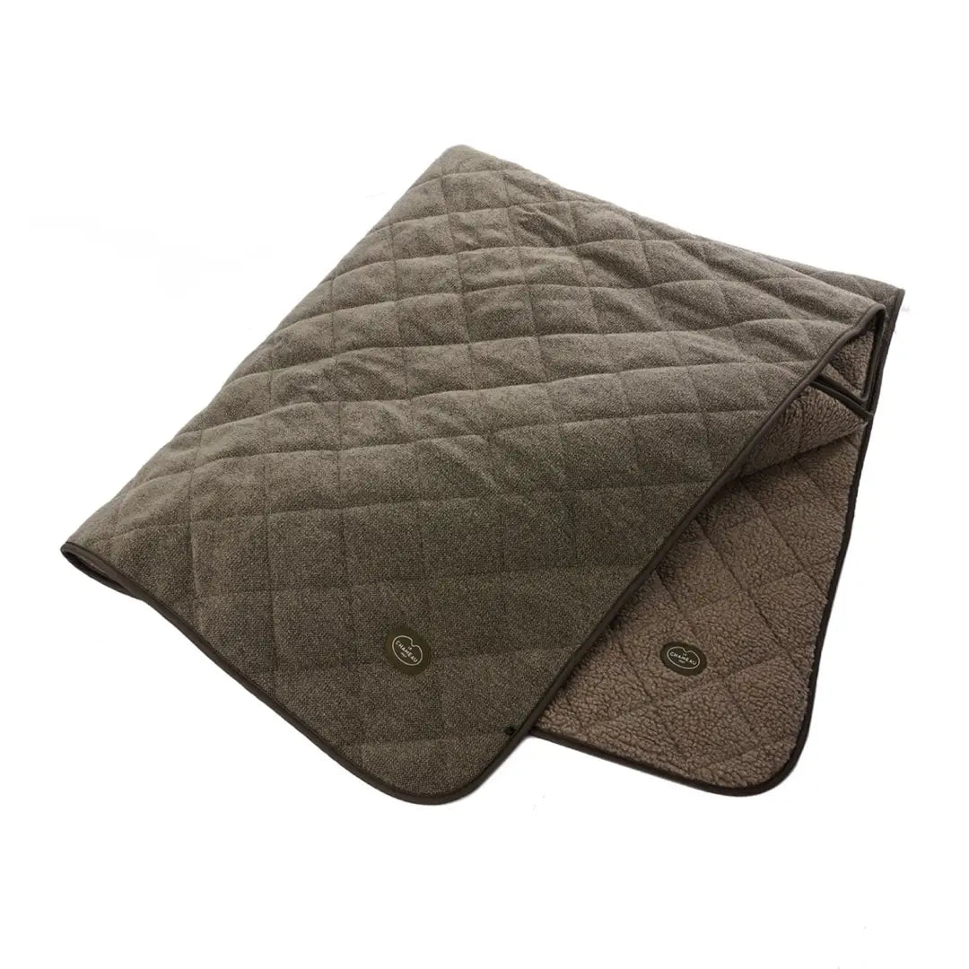 Cozy Le Chameau Quilted Throw with diamond pattern and Chameau rubber branding