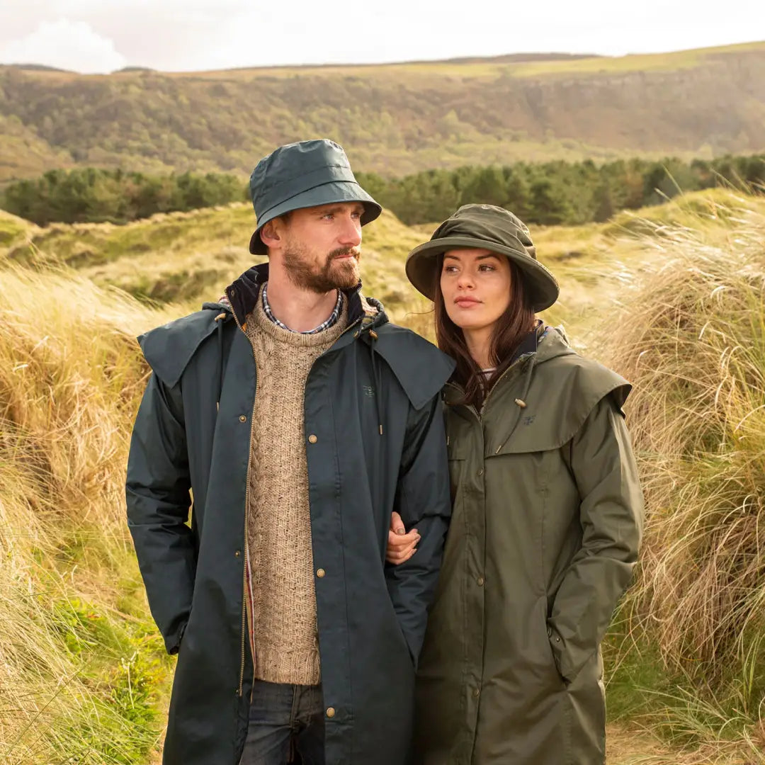 Couple in outdoor gear enjoying the sun with Lighthouse Canterbury Waterproof Ladies Hat