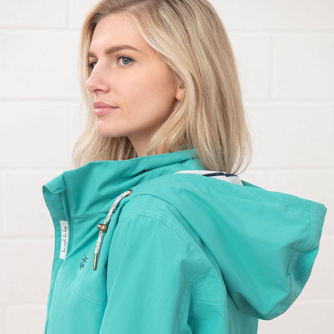 Turquoise hooded jacket from the Lighthouse Ladies Beachcomber II Coat collection