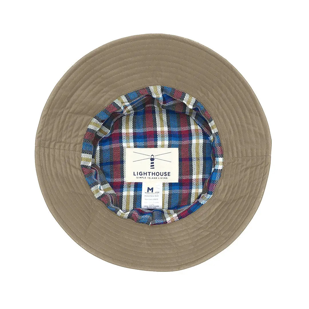 Beige bucket hat with plaid lining, perfect for the Lighthouse Storm Waterproof vibes