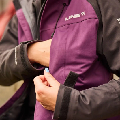 Purple and black Line 7 Storm Pro20 jacket showcasing peak level waterproof quality