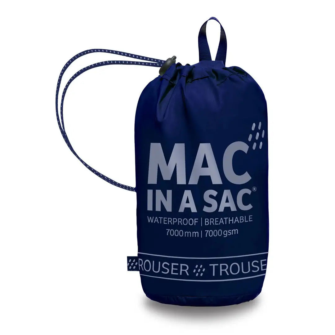 Navy blue MAC IN A SAC drawstring bag with details on highly waterproof overtrousers