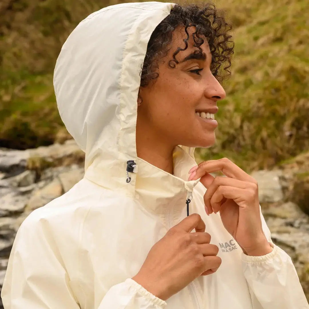 Cream-colored Mac in a Sac Origin waterproof jacket with fully taped seams worn outside