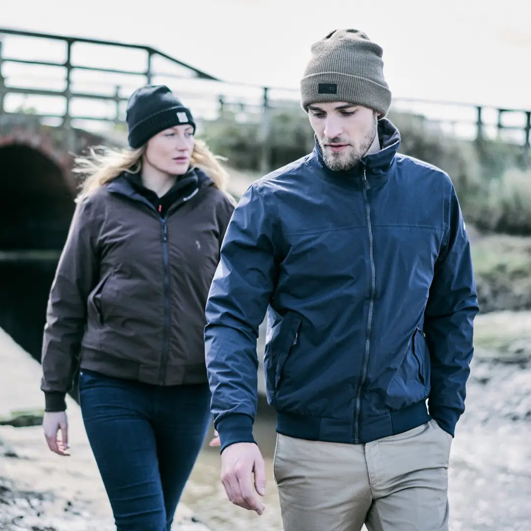 Two people enjoying the outdoors in Musto Snug Blouson Jackets on a chilly day