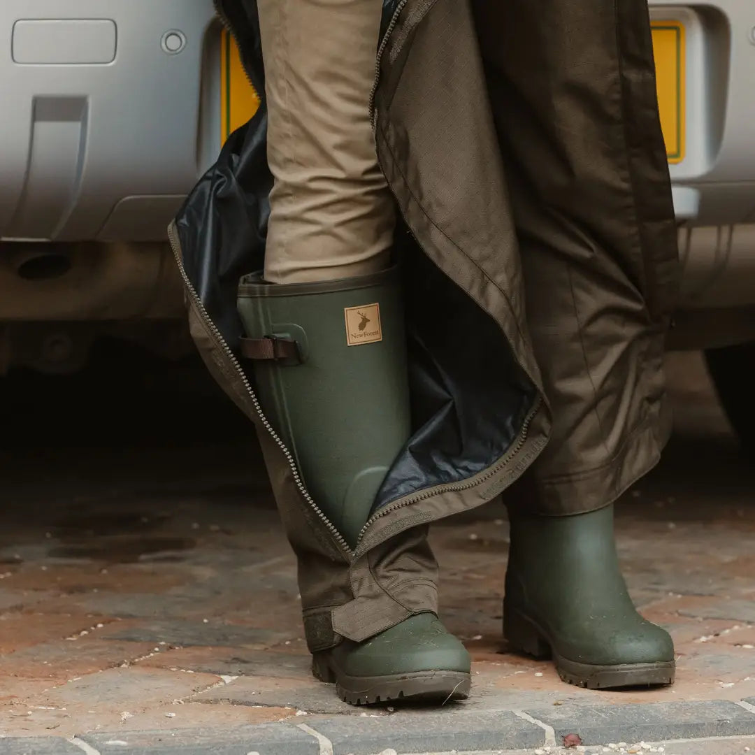 Green rubber Forest Avon zip Wellington Boots with khaki pants and a dark coat