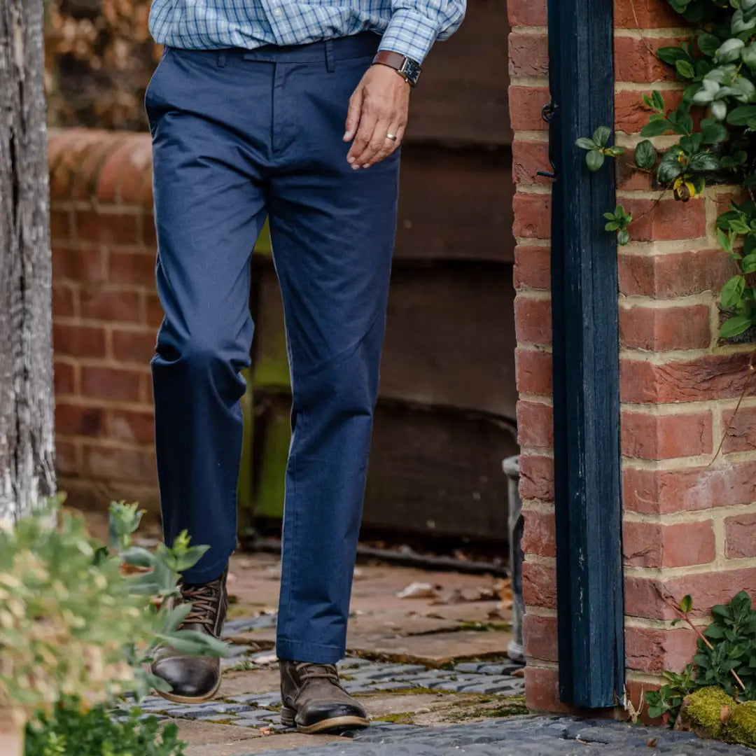 Navy blue regular fit New Forest Classic Chinos worn by a person in a doorway