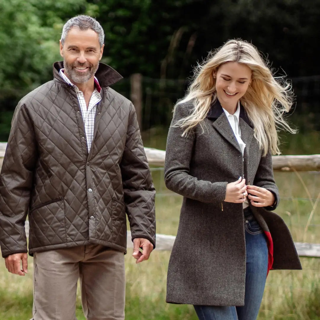 Two people in autumn coats enjoying the outdoors with their Forest Classic Quilted Jackets