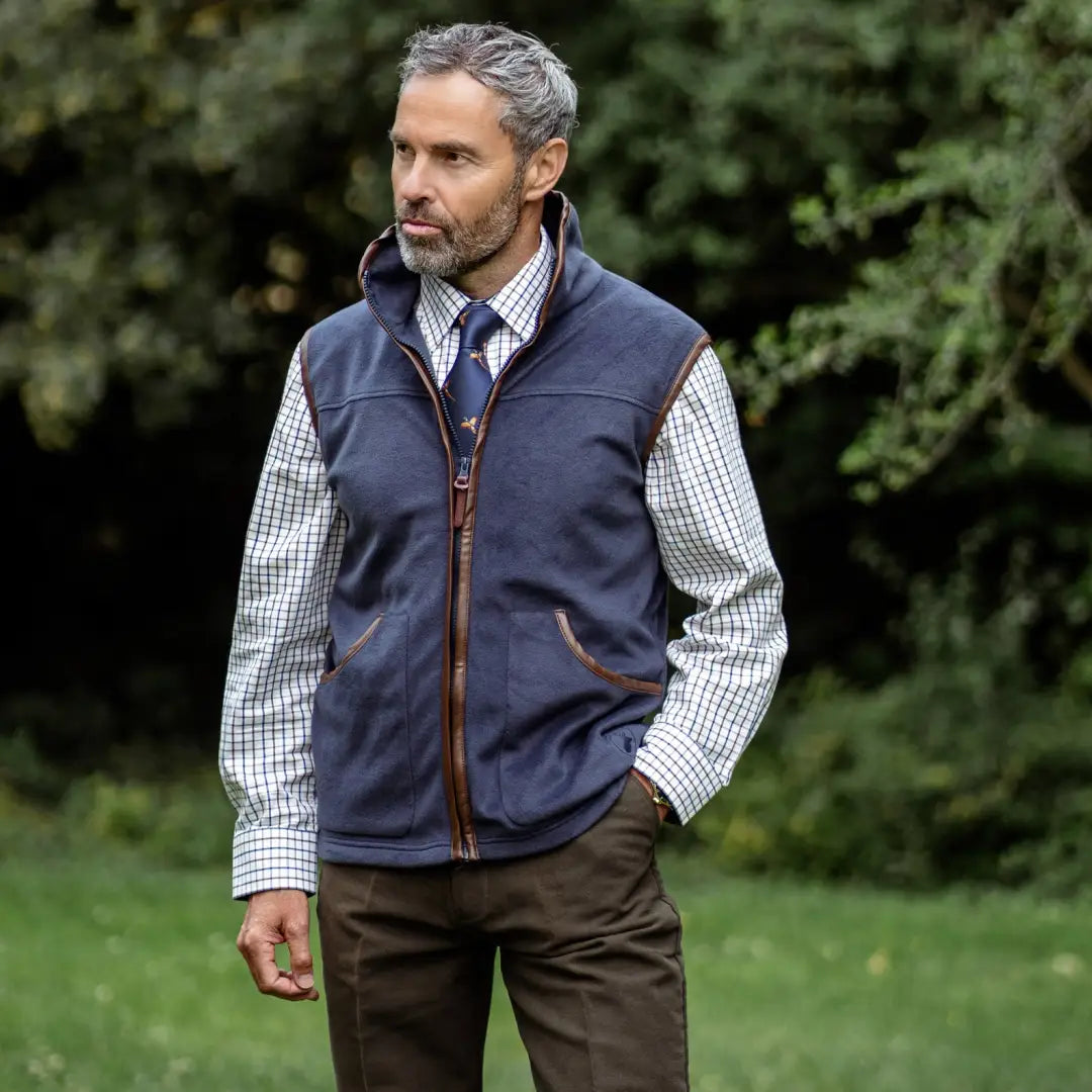 Navy blue quilted fleece gilet over a checked shirt, perfect for forest adventures