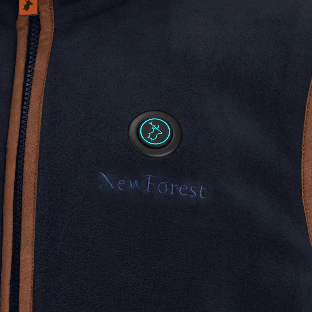 Navy blue heated fleece gilet with brown trim and glowing teal ship button