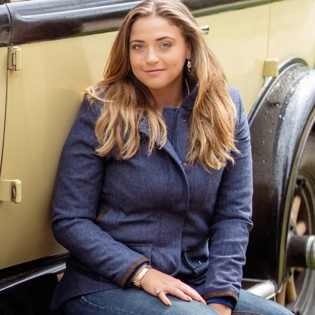 Young woman in navy blue coat showcasing the New Forest Jessica Tweed Field Coat