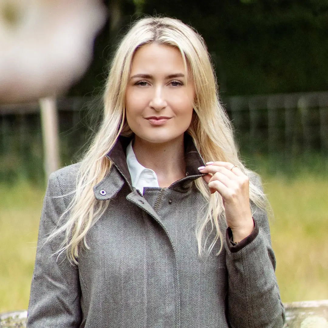 Blonde woman in a gray coat and white shirt modeling the Forest Jessica Tweed Field Coat