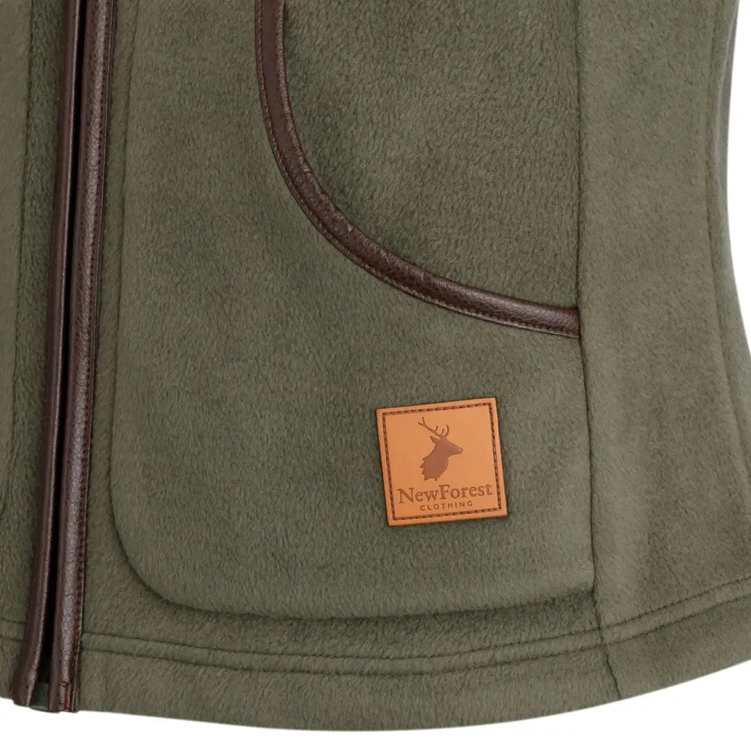 Olive green ladies fleece gilet with leather NordForest logo patch for cozy style