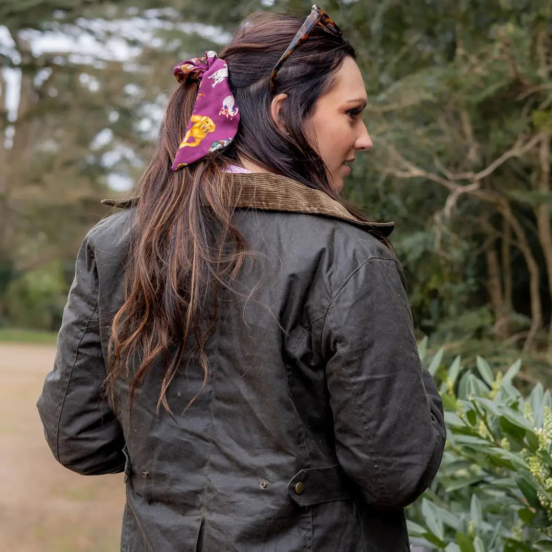 Dark jacket on a person with long hair, perfect for country clothing and hunting