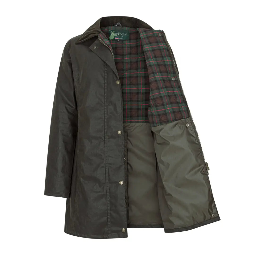 Dark green wax jacket with plaid lining, perfect for country clothing and hunting