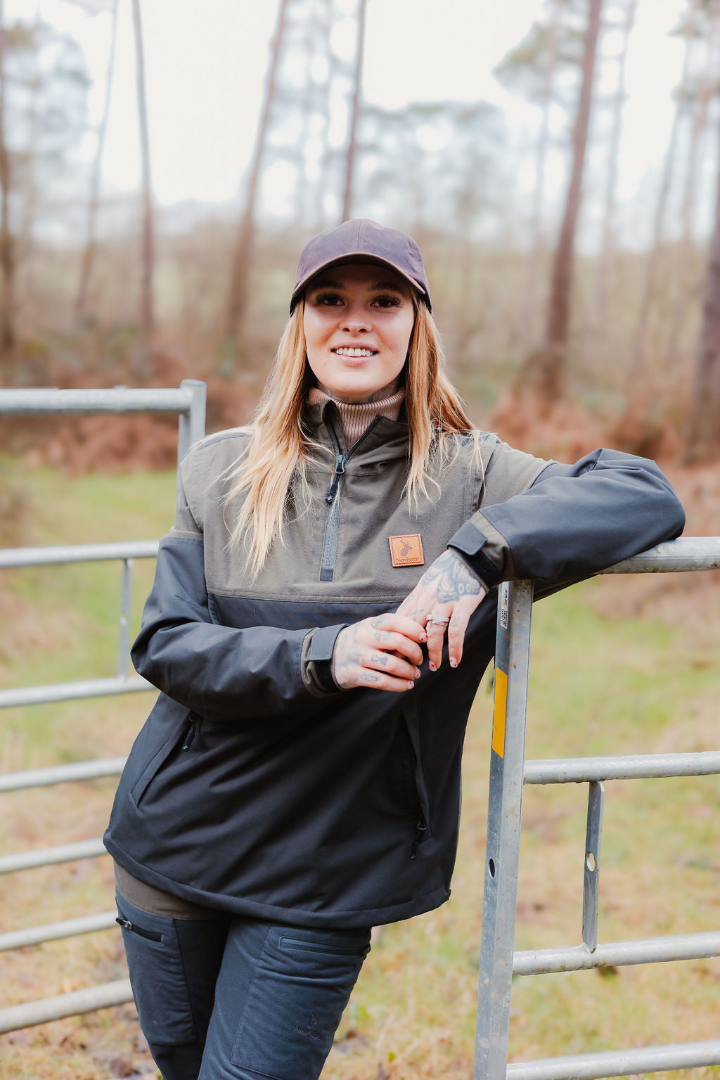 Woman wearing a stylish two-tone Forest Nightjar Smock jacket outdoors