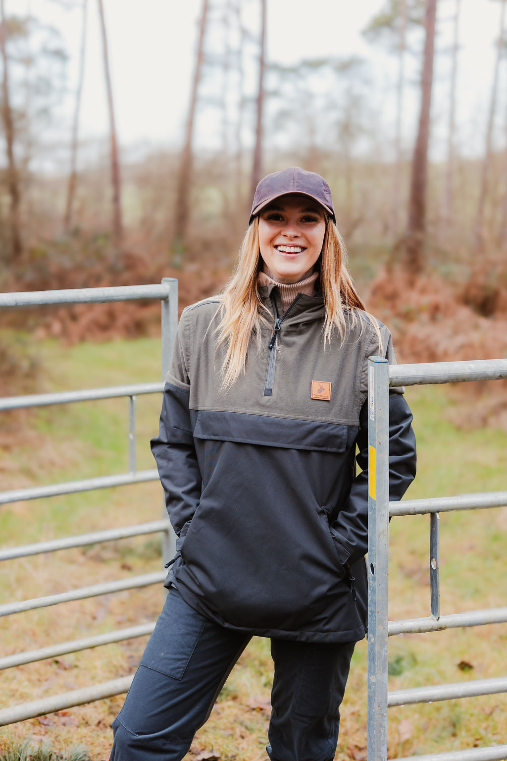 Woman rocking a two-tone Forest Nightjar Smock and baseball cap outdoors