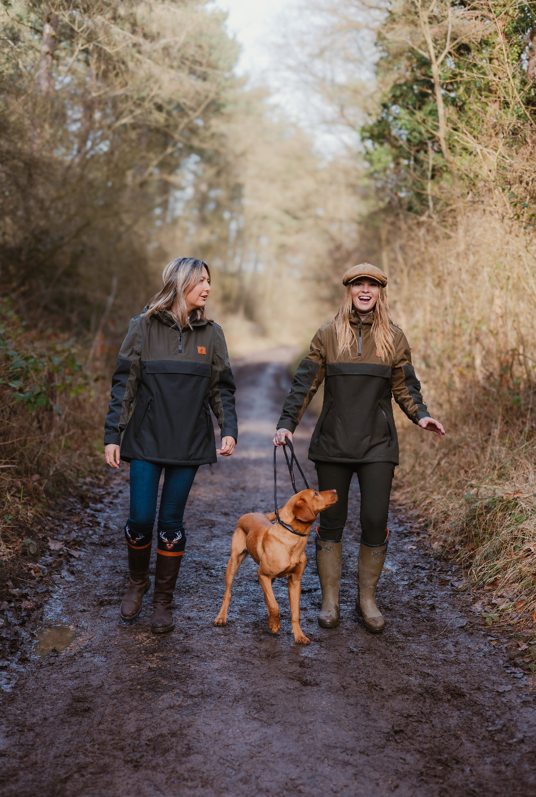 Two women in a Forest Nightjar Smock stroll with a dog in nature