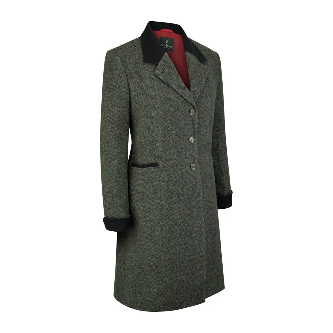 Long green Lizzie Tweed Coat with black collar and cuffs for a chic forest look