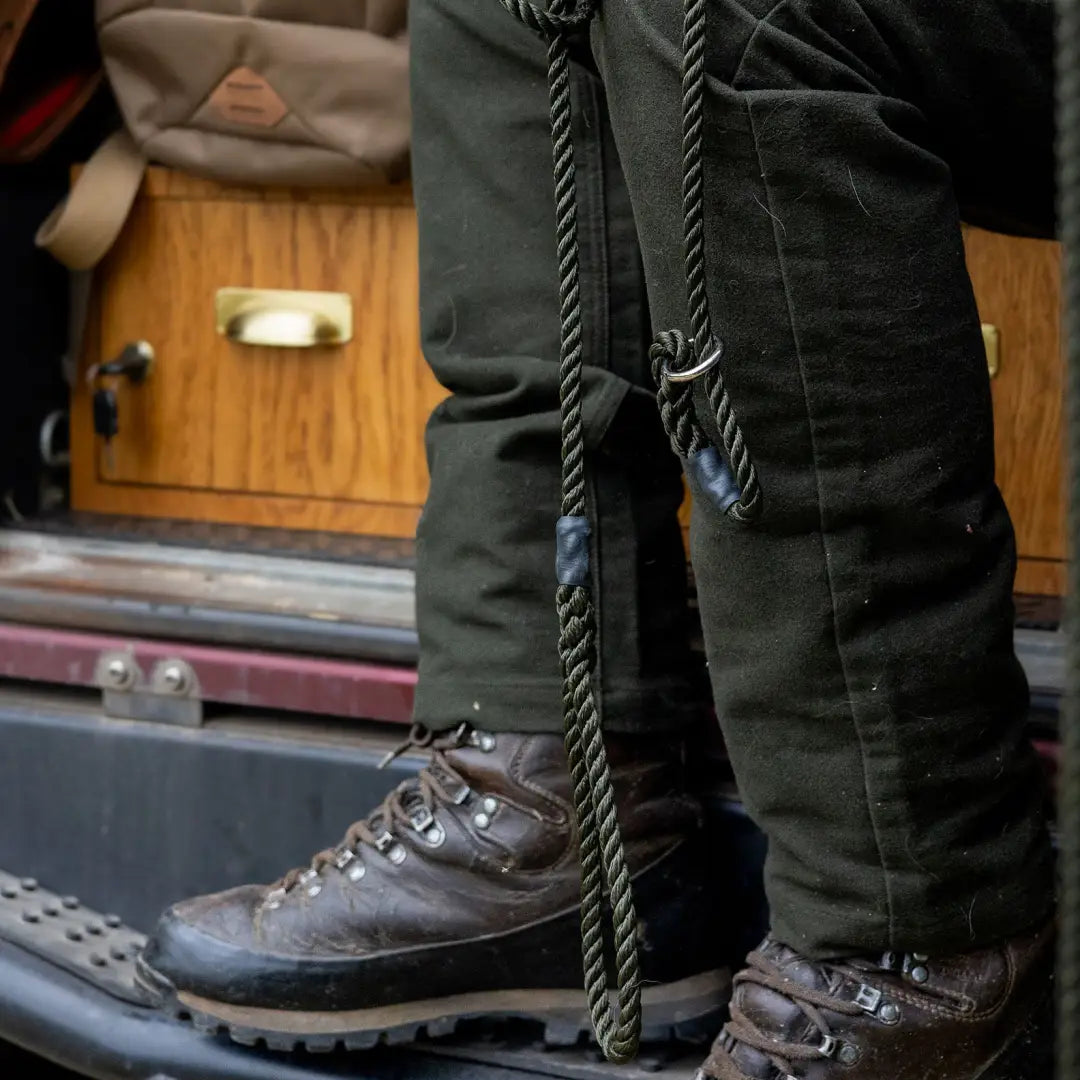 Rugged hiking boots with dark pants and a rope, styled with Forest Moleskin Jeans