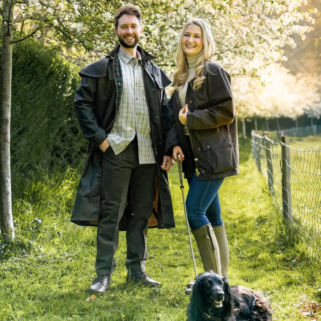 Couple in New Forest Moleskin Trousers enjoying a day out with their dog