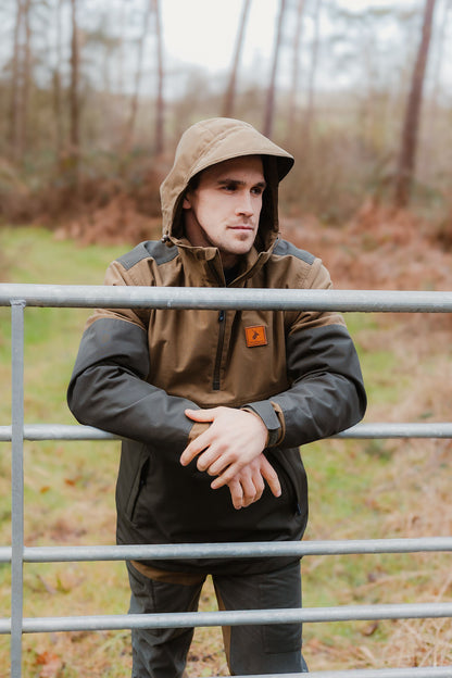 Man in hooded jacket showcasing the Forest Nightjar Smock, perfect for outdoor adventures